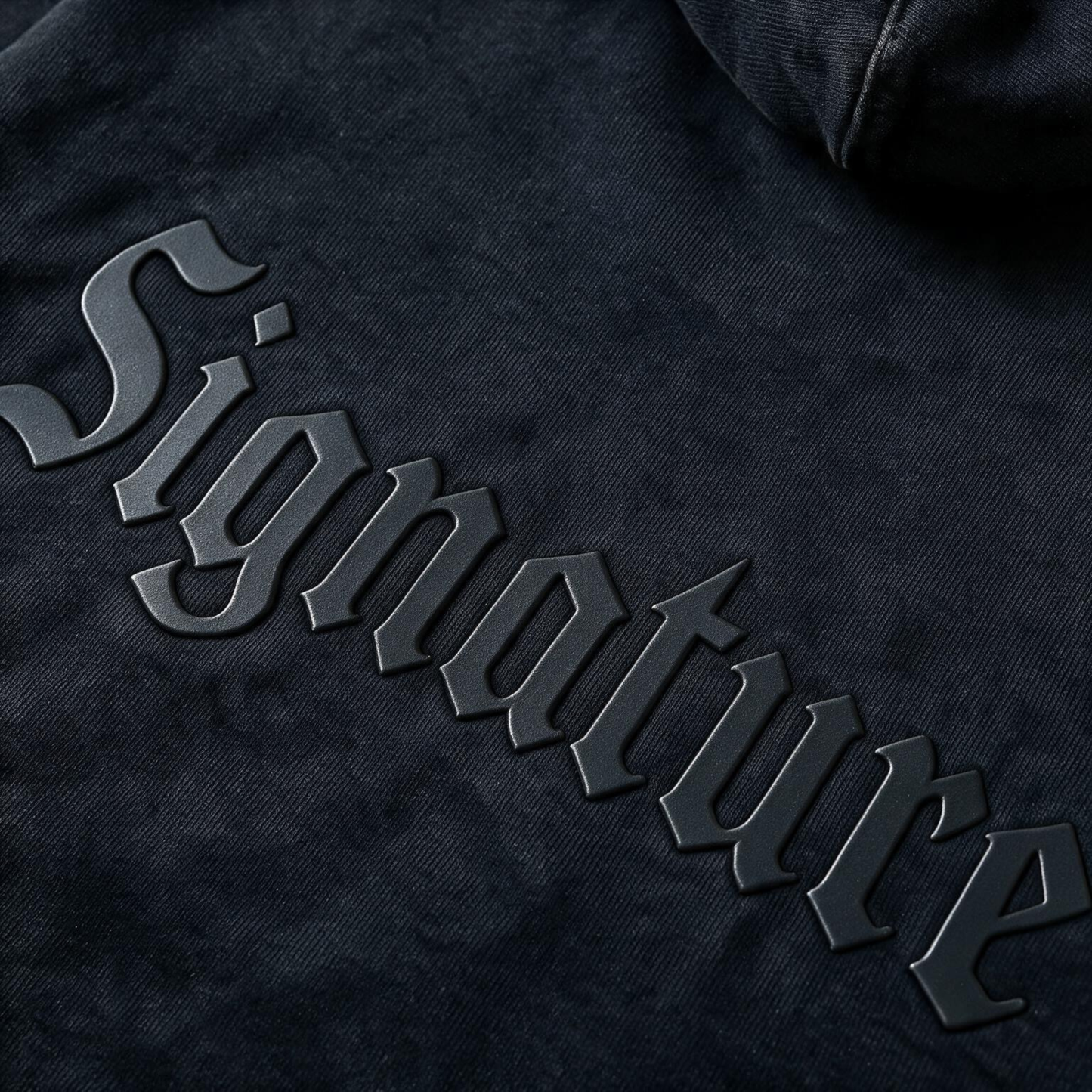Black Hoodie with a tonal "SIGNATURE" print on the back and an oversize.