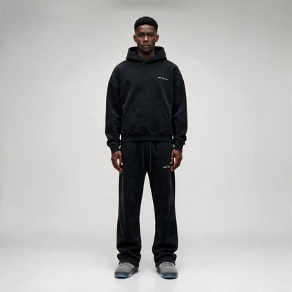 Black hoodie featuring a matching white "SIGNATURE"