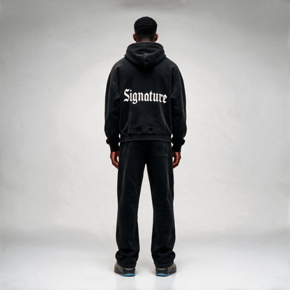 Black hoodie featuring a matching white "SIGNATURE"