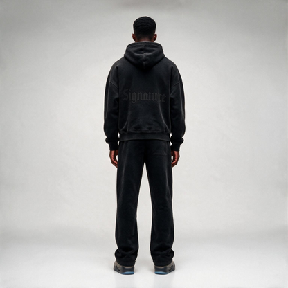 Black Hoodie with a tonal "SIGNATURE" print on the back and an oversize.